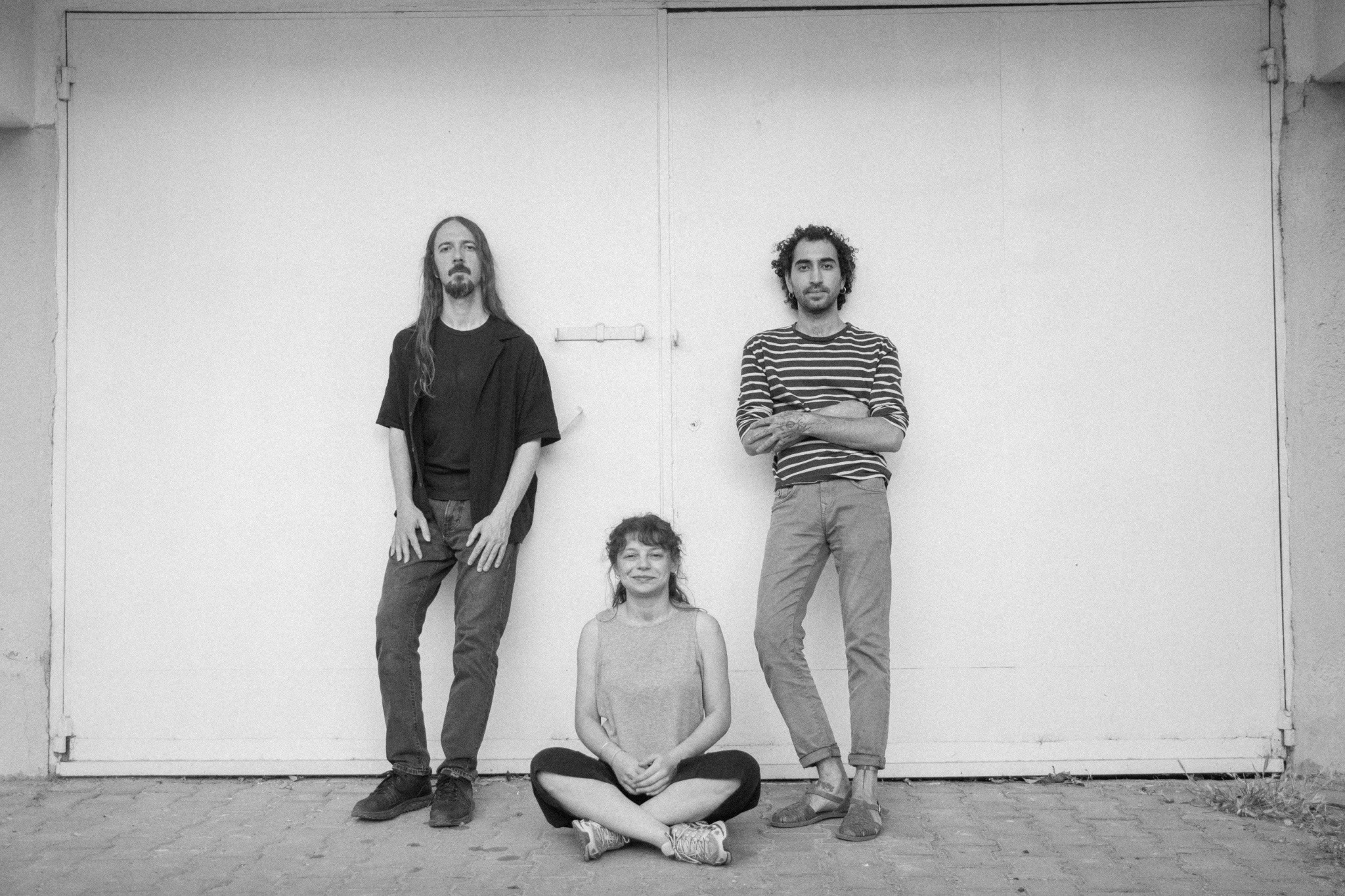 The three members of saraph, photographed in black and white